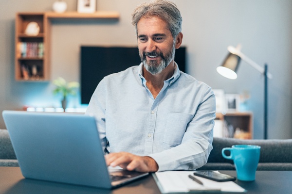 Accountant working on Hubspots free CRM in his home office