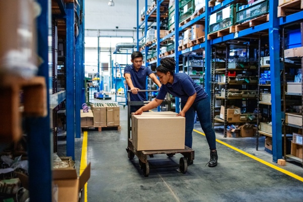 Asset-based carrier employees moving boxes