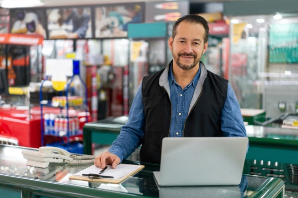 Business owner comparing Real-Time Shipping Quotes vs. ShippingEasy to find the right fit for his business