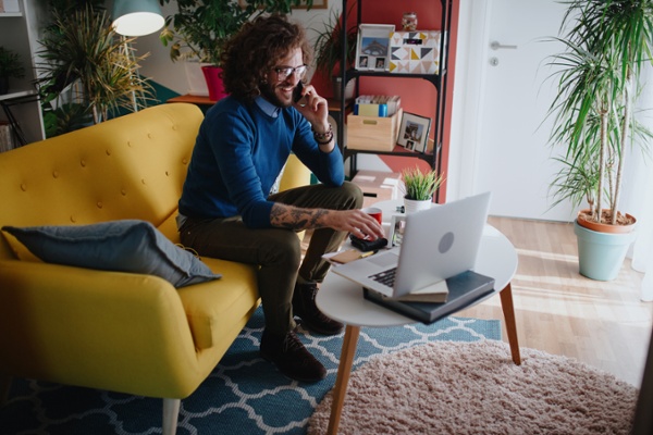 Customer service employee working in his home