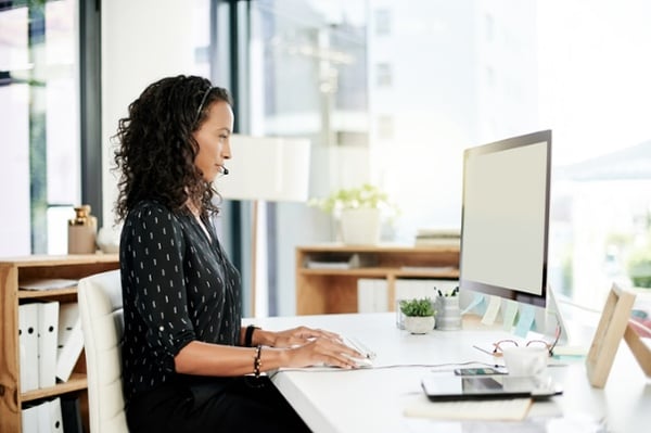 Customer service professional at her desk