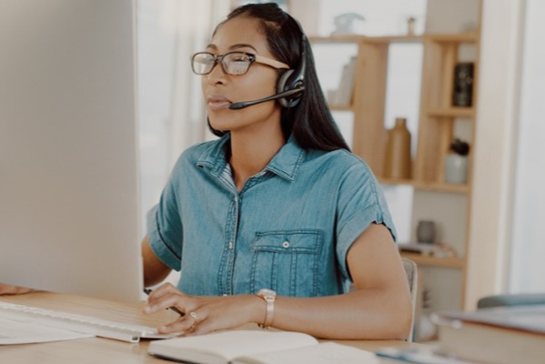 Customer service representative working in her home office