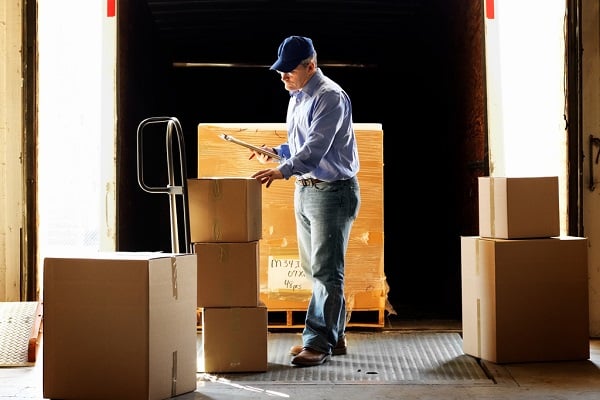 Delivery pro organizing his white glove delivery schedule