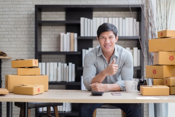 Entrepreneur managing the shipping component of his e-commerce business