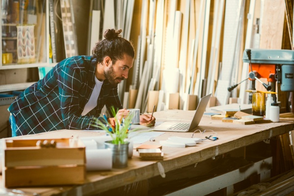 Lumber business owner looking up the NMFC number for an upcoming shipment-1