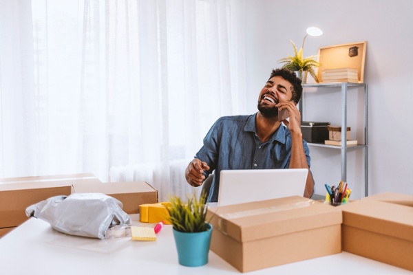 Man working on shipping tasks for his business