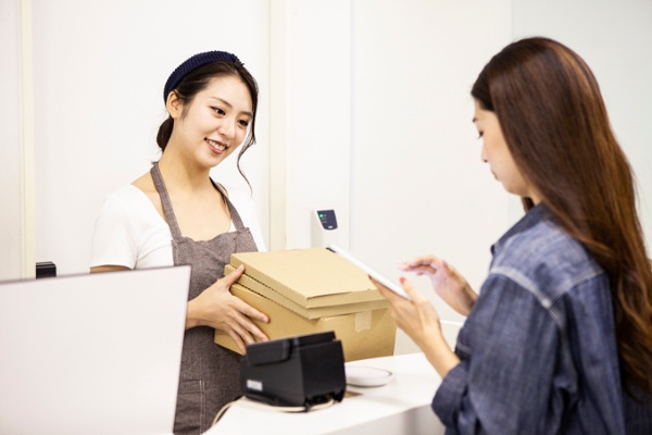 Recipient picking up a package from a retail location