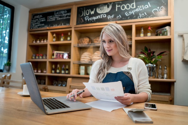 Restaurant owner handling finances